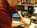 5. Tristan took a dislike to the Windows Vista logo on the tablet.